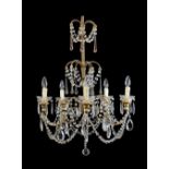 20th Century cut glass five-branch chandelier, with octagonal lustre swags, tear drop pendants