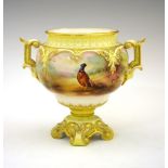 Edwardian Royal Worcester porcelain two-handled pedestal vase, decorated with a pheasant signed A.C.