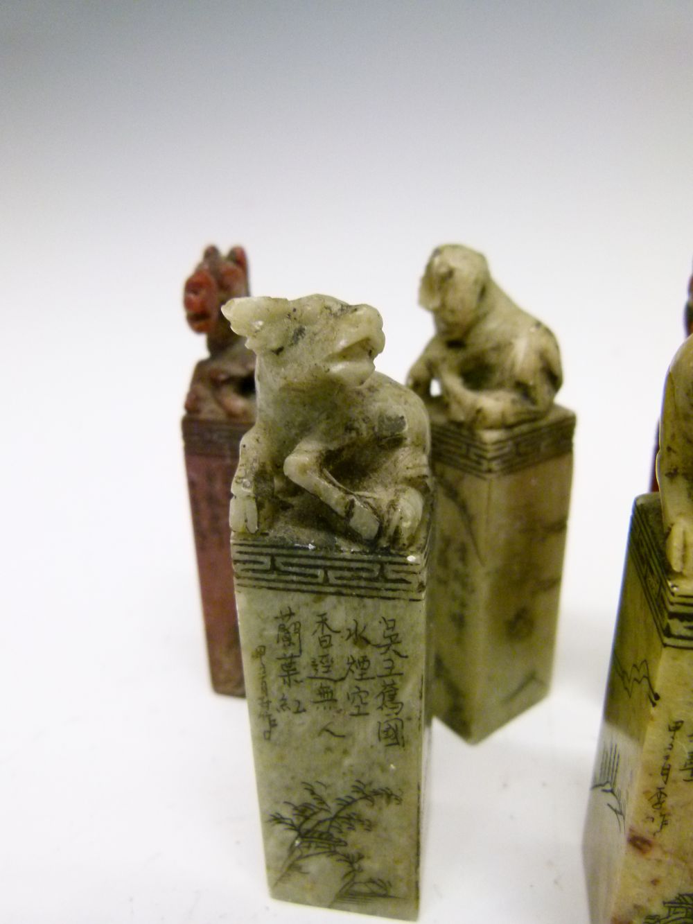 Set of twelve Chinese soapstone desk seals, each surmounted by a differing animal symbolising the - Image 12 of 14