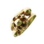 Gentleman's unmarked yellow metal dress ring, set with central flowerhead design between ball