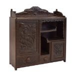 Early 20th Century Japanese carved hardwood table-top cabinet, with carved pediment depicting clouds