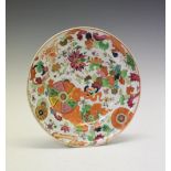Chinese Canton Famille Rose porcelain plate, circa 1800, of dished circular form decorated with
