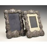 Pair of Elizabeth II silver easel photograph frames, the border with embossed Reynolds Angels and