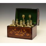 19th Century Dutch marquetry decanter box, the hinged cover with curved front enclosing six gilt-