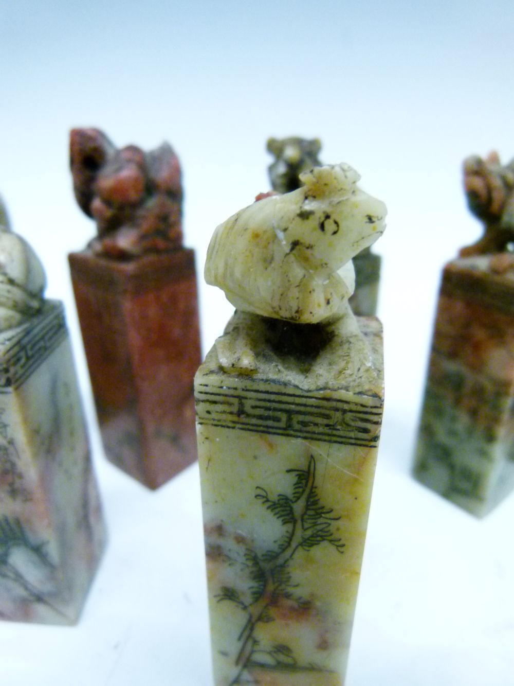 Set of twelve Chinese soapstone desk seals, each surmounted by a differing animal symbolising the - Image 9 of 14