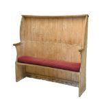 19th Century pine, sycamore and elm wing-back settle, of gently curved design with shaped wings