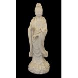 Chinese porcelain blanc-de-Chine figure of Guanyin or Kwan Yin, of Dehua type modelled with right