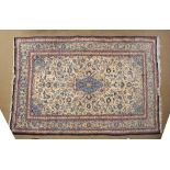 Persian-style wool rug or carpet, the sand-coloured ground with central lobed medallion and matching