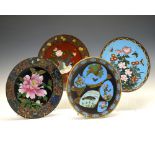 Four assorted early 20th Century Oriental cloisonné dishes, each approximately 30cm diameter (4)
