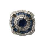 Unmarked white metal, sapphire and diamond dress ring, of concentric design with central faceted