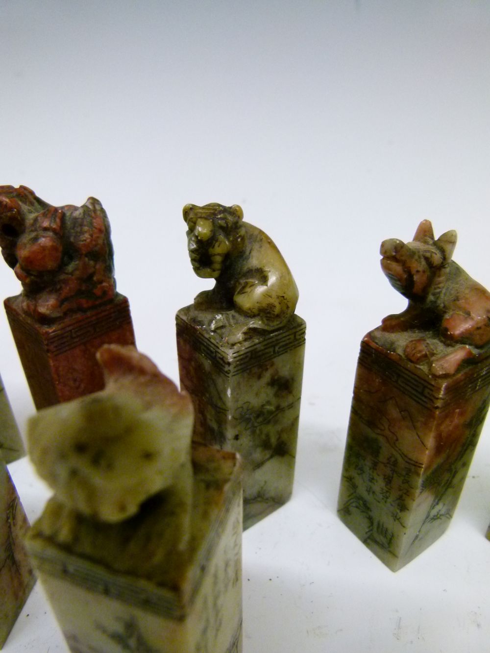 Set of twelve Chinese soapstone desk seals, each surmounted by a differing animal symbolising the - Image 10 of 14