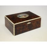 Early 20th Century burr yew and ivory box, the hinged cover centred by an oval plaque painted with a