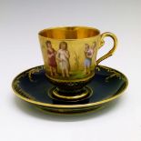 Late 19th Century Vienna cabinet cup and saucer, painted with a frieze of children against gilt