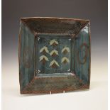 David Frith (1943-) - Brookhouse Pottery - Large studio pottery square dish, on four feet, on a dark