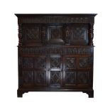 17th Century and later oak press or court cupboard, with later cornice over arch-carved frieze, with