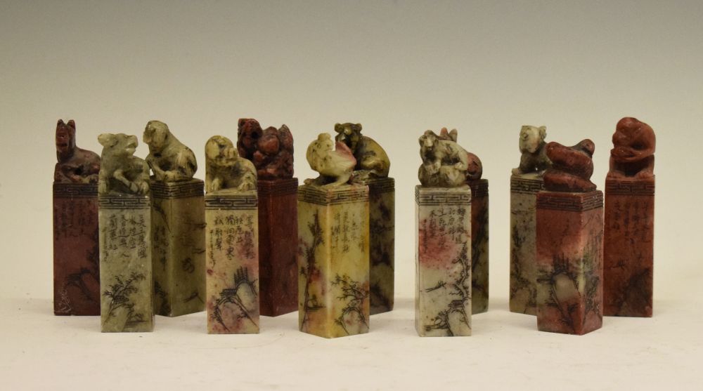 Set of twelve Chinese soapstone desk seals, each surmounted by a differing animal symbolising the