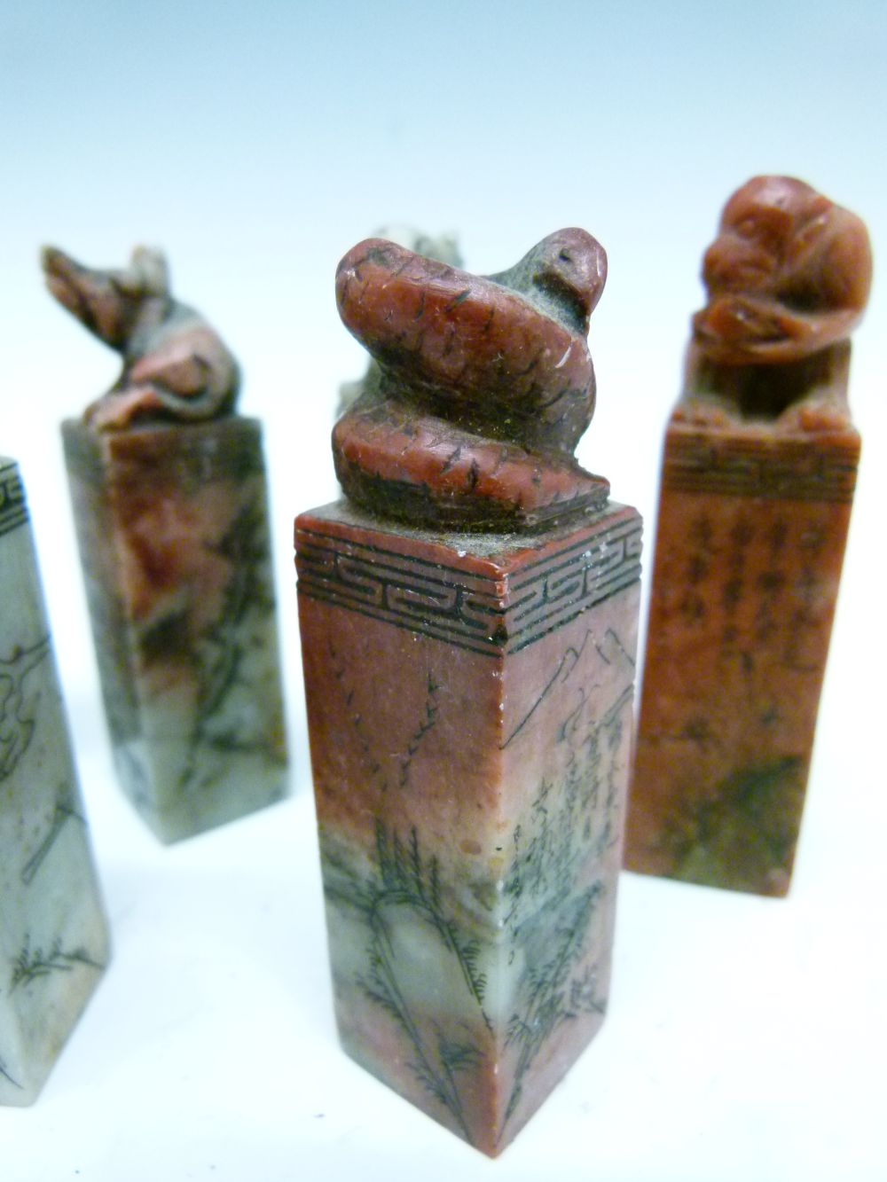 Set of twelve Chinese soapstone desk seals, each surmounted by a differing animal symbolising the - Image 5 of 14