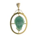 Oriental unmarked yellow metal and jade pendant, carved in high relief with the head of a lady,