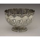 Edward VII silver bowl or Monteith, with shaped rim, floral embossed decoration and circular