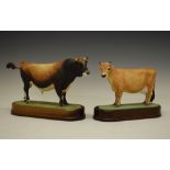 Royal Worcester model 1961 bone china 'Jersey Cow', together with model 1965 'Jersey Bull', both