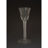 18th century opaque spiral twist cordial glass, the rounded funnel bowl with panel moulded lower