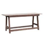 Rustic 18th Century refectory-style serving table, possibly Spanish, the two-plank top with iron