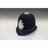 British policeman's helmet having Avon and Somerset Constabulary badge
