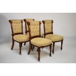 Set of four Victorian oak dining chairs having button back and stuff over seats on turned front