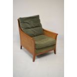 Modern bergere-caned easy chair having double-caned sides, padded back and loose cushions