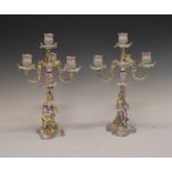 Pair of late 19th.early 20th Century Continental porcelain three branch figural candelabra, 36cm