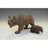 Two carved Black Forest bears, the largest standing 12cm overall