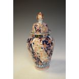 Imari octagonal baluster shaped vase and cover, the base with four character mark, 34cm high