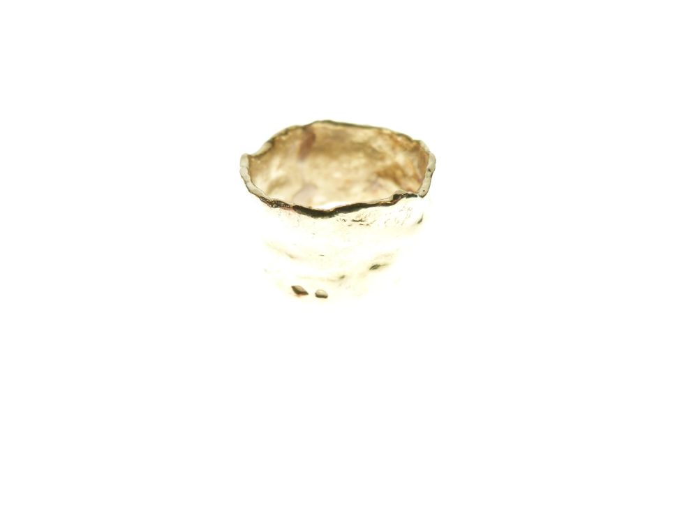 French gold ring of irregular design with eagle head stamp indicating purity of at least 18ct,