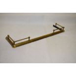 Brass adjustable fire fender, approximately 155cm wide fully extended