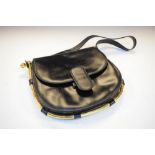 Black leather and brass handbag stamped inside 'Made in Italy by Gucci'