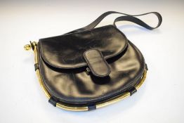 Black leather and brass handbag stamped inside 'Made in Italy by Gucci'