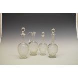 Three decanters of matching design to include a pair, 31cm high, plus a matching jug (4)