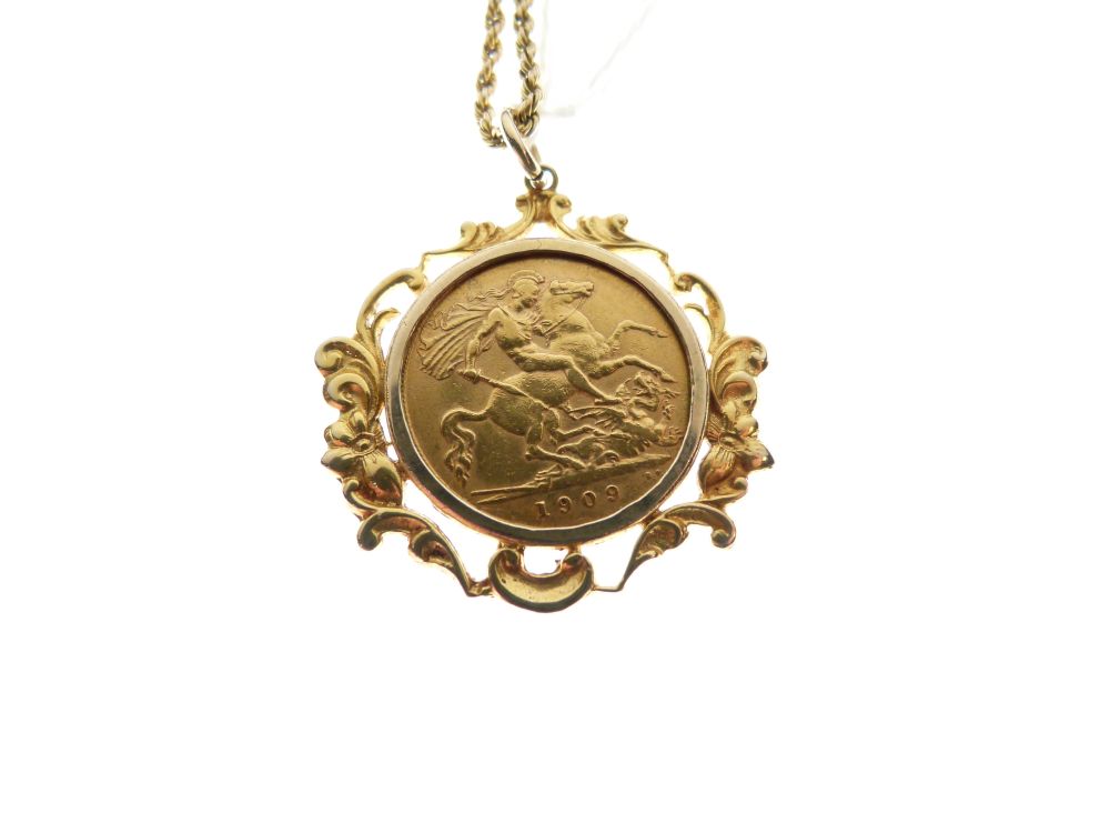 Gold Coin - Edward VII Half Sovereign 1909, in foliate scroll frame as pendant, together with a