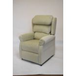 Modern recliner armchair upholstered in sage green plush fabric