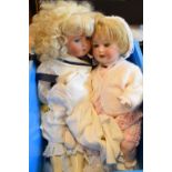 Two 20th Century German bisques headed dolls, various clothing, tallest 59cm high