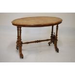 Victorian walnut and string inlaid oval side table, 106cm wide
