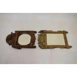 18th Century Continental giltwood wall mirror, the later oval mirror plate beneath putto surmount