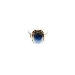 Yellow metal dress ring set blue oval cabochon, shank stamped 14k, size N, 3.9g gross approx