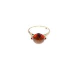 Yellow metal dress ring set with amber-coloured cabochon, shank stamped 14k, size L½, 2.5g gross