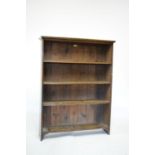 Early 20th Century stained beech open bookcase fitted three shelves, bearing Trapnell & Game