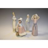 Four Lladro figures, the tallest standing 26cm high