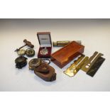 World War II compass, one other compass, two pocket watches, cylindrical calculator, etc