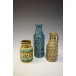 Three pieces of West German relief moulded pottery, the largest standing 26cm high