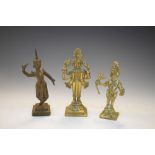 Two Indian bronze figures of deities, largest 12.5cm high, together with a South East Asian figure