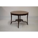 Edwardian mahogany and string inlaid satinwood crossbanded centre table having shaped top and